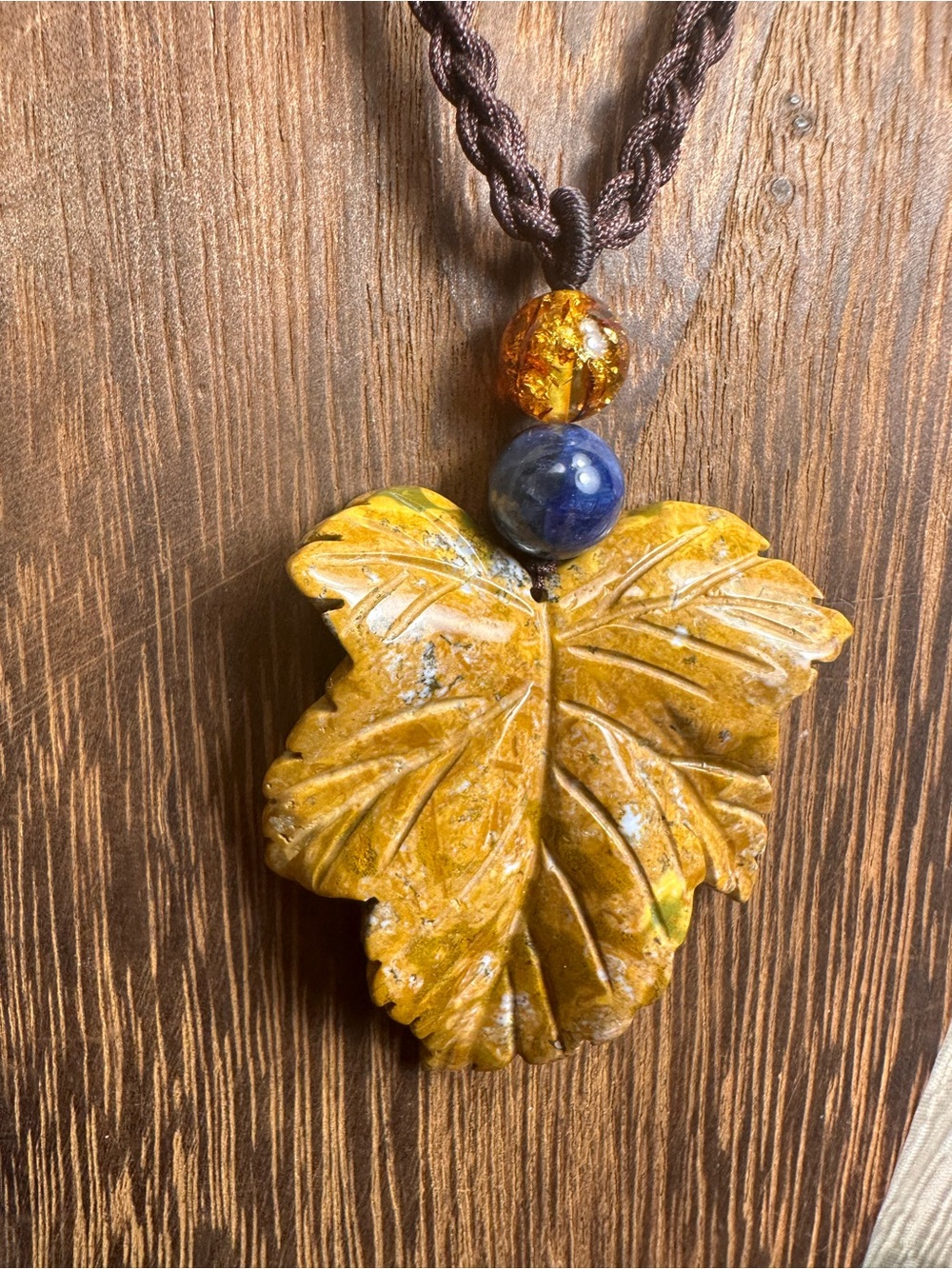 Yellow Ocean Jasper Leaf Carving Pendant Necklace on Brown Braided Rope - Picture 5 of 13